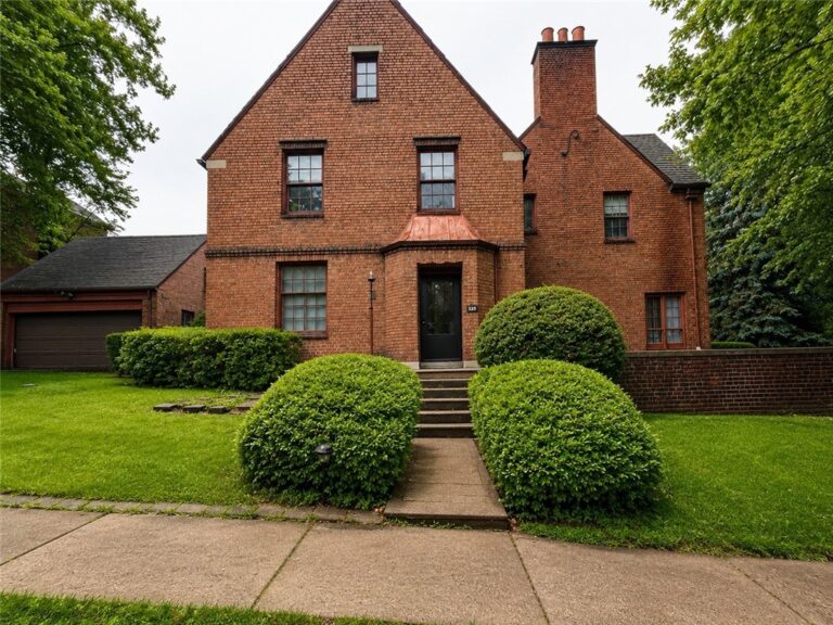 The Manor Avenue Tudor: 1939 Brick Revival | $99,500